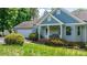 Charming home with a welcoming front porch, well-manicured landscaping, and a convenient two-car garage at 109 Gatwick Ct, Statesville, NC 28677