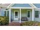 Cozy front porch with a bench, brick steps, and lovely landscaping, perfect for relaxing outdoors at 109 Gatwick Ct, Statesville, NC 28677