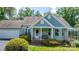 Inviting front porch with a cozy bench, brick steps, and well-maintained landscaping creates a welcoming entrance at 109 Gatwick Ct, Statesville, NC 28677