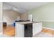 Open kitchen with granite countertops and views into the living area at 109 Gatwick Ct, Statesville, NC 28677