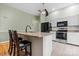 Bright eat-in kitchen with granite countertops, stainless appliances, and a breakfast bar at 109 Gatwick Ct, Statesville, NC 28677