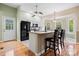 Bright eat-in kitchen with granite countertops, stainless appliances, and a breakfast bar at 109 Gatwick Ct, Statesville, NC 28677