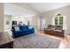 Spacious living room featuring a large rug, comfortable seating, and abundant natural light at 109 Gatwick Ct, Statesville, NC 28677