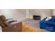 Spacious living room with hardwood floors, comfortable seating, and an elegant area rug, creating a cozy ambiance at 109 Gatwick Ct, Statesville, NC 28677