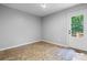 Room featuring linoleum flooring and an exterior door leading to a deck, offering natural light at 109 Gatwick Ct, Statesville, NC 28677