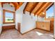 Attic space features wood ceiling beams, a sink with vanity, and natural lighting from the large windows at 11227 Cool Springs Rd, Cleveland, NC 27013