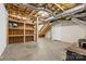 Unfinished basement with concrete floor, stairs, door, wooden shelves and exposed utilities at 11227 Cool Springs Rd, Cleveland, NC 27013