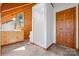 Bright bathroom featuring wood paneling, neutral color palette, modern vanity and white walk-in shower at 11227 Cool Springs Rd, Cleveland, NC 27013