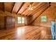 Bright, spacious bedroom with wood accents, vaulted ceiling, and three windows at 11227 Cool Springs Rd, Cleveland, NC 27013