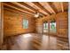 Bedroom boasts natural lighting, gorgeous wood ceiling, and sliding glass doors leading to a balcony at 11227 Cool Springs Rd, Cleveland, NC 27013