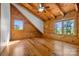 Bright bedroom features a vaulted wood ceiling, natural lighting, and two large windows at 11227 Cool Springs Rd, Cleveland, NC 27013