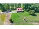 Charming cabin on expansive lawn with pond, well, and surrounded by lush greenery at 11227 Cool Springs Rd, Cleveland, NC 27013