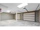 Spacious three car garage featuring concrete block walls and garage doors ready for your vehicles at 11227 Cool Springs Rd, Cleveland, NC 27013