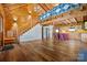 Open floor plan with staircase, wood floors, and red accent island at 11227 Cool Springs Rd, Cleveland, NC 27013