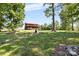 Beautiful home exterior surrounded by green grass and mature trees, set on a spacious lot at 11227 Cool Springs Rd, Cleveland, NC 27013