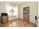 Office space featuring wood-look floors, natural light, and neutral walls at 120 Tranquil Ct, Locust, NC 28097