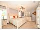 Spacious main bedroom features a ceiling fan, carpet, and natural light from two windows at 120 Tranquil Ct, Locust, NC 28097