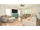 Spacious living room features lots of natural light and wood-look floors at 120 Tranquil Ct, Locust, NC 28097