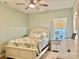 Comfortable bedroom featuring light green paint, light floors, and soft, natural light at 132 Swimmers Ln, Salisbury, NC 28146