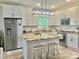 Modern kitchen featuring stainless steel appliances, granite counters, and a center island at 132 Swimmers Ln, Salisbury, NC 28146