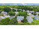 Picturesque aerial view of a residential area with charming homes nestled among mature trees and lush landscaping at 1458 Bedlington Nw Dr, Charlotte, NC 28269