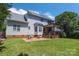 Spacious backyard with a deck and patio area, perfect for outdoor entertaining at 1458 Bedlington Nw Dr, Charlotte, NC 28269