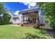 Beautiful backyard with a well-manicured lawn, a charming deck, and a cozy patio area for outdoor enjoyment at 1458 Bedlington Nw Dr, Charlotte, NC 28269