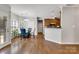 Dining area with hardwood floors and access to the kitchen with updated cabinetry at 1458 Bedlington Nw Dr, Charlotte, NC 28269