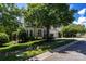Charming two-story house featuring a well-manicured front yard and traditional architectural details at 1458 Bedlington Nw Dr, Charlotte, NC 28269