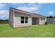 Spacious backyard featuring a covered patio and green grass, ideal for outdoor activities and relaxation at 1510 Doran Ter, Richburg, SC 29729