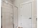 Bathroom featuring glass enclosed shower with tiled walls and built in shelves at 1510 Doran Ter, Richburg, SC 29729