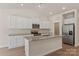 Modern kitchen features granite countertops, white cabinetry, stainless steel appliances, and ample storage at 1510 Doran Ter, Richburg, SC 29729