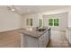 Stylish kitchen island with granite countertop, sink, and ample cabinet space, perfect for meal preparation and entertaining at 1510 Doran Ter, Richburg, SC 29729