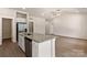 Granite island counter overlooks an open living space, complete with stainless dishwasher and wooden floors at 1510 Doran Ter, Richburg, SC 29729