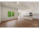 Open-concept living area with sleek hardwood floors, a ceiling fan, and lots of natural light at 1510 Doran Ter, Richburg, SC 29729