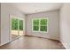 Bright and airy living room with sliding glass doors and large windows offering scenic views, perfect for relaxation and entertaining at 1510 Doran Ter, Richburg, SC 29729