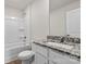 Bathroom with vanity featuring granite countertops, modern fixtures, and a tub at 1512 Doran Ter, Richburg, SC 29729