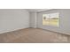 Cozy bedroom with carpet flooring, natural light, and a neutral color palette at 1512 Doran Ter, Richburg, SC 29729