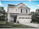 Charming two-story home with white siding, black shutters, and a two-car garage, surrounded by a well-manicured lawn at 1512 Doran Ter, Richburg, SC 29729