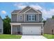 Charming two-story home with a two-car garage and well-maintained lawn at 1512 Doran Ter, Richburg, SC 29729