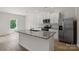 Bright kitchen featuring an island, stainless steel appliances, and an open floor plan at 1512 Doran Ter, Richburg, SC 29729