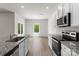 Modern kitchen featuring an island, stainless steel appliances, and a view of the backyard at 1512 Doran Ter, Richburg, SC 29729