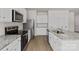 Well-equipped kitchen with stainless steel appliances, granite countertops, and ample cabinet space at 1512 Doran Ter, Richburg, SC 29729