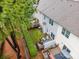 Aerial shot showcasing multiple decks with outdoor seating, complemented by well-maintained lawns and privacy hedges at 15554 Stronvar House Ln, Charlotte, NC 28277