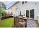 Enjoy the backyard view from this deck, showcasing green grass and mature trees at 15554 Stronvar House Ln, Charlotte, NC 28277
