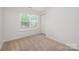 Bedroom featuring a window, closet, and carpet at 15554 Stronvar House Ln, Charlotte, NC 28277