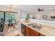 Dining area with a view features stylish lighting and overlooks the adjacent living room at 15554 Stronvar House Ln, Charlotte, NC 28277