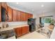Well-maintained kitchen with sleek black appliances and ample wood cabinetry at 15554 Stronvar House Ln, Charlotte, NC 28277