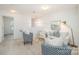 Cozy loft living room with comfortable seating, a modern rug, and ample natural light at 15554 Stronvar House Ln, Charlotte, NC 28277