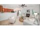 Open-concept living room with fireplace flows into the kitchen and dining area at 15554 Stronvar House Ln, Charlotte, NC 28277